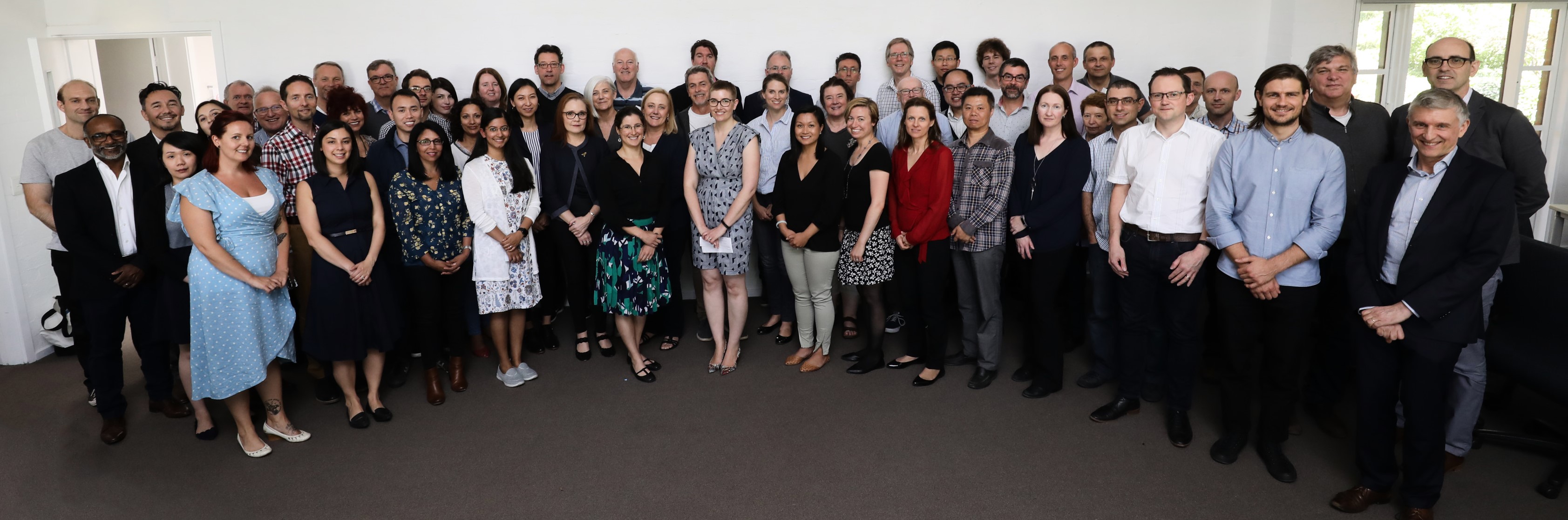 Group photo of female and male cancer researchers and scientists